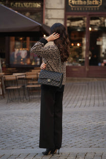 Cardigan animalier in maglia con bordi neri