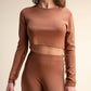 Top corto in maglia con frange sulle maniche