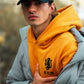 Felpa unisex New Year senape con stampa