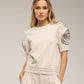 Maglia in cotone con maniche a rosetta