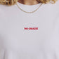 T-shirt bianca con ricamo “No Grazie”