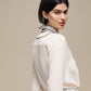 Blusa donna color perla con collo arricciato e fiocco
