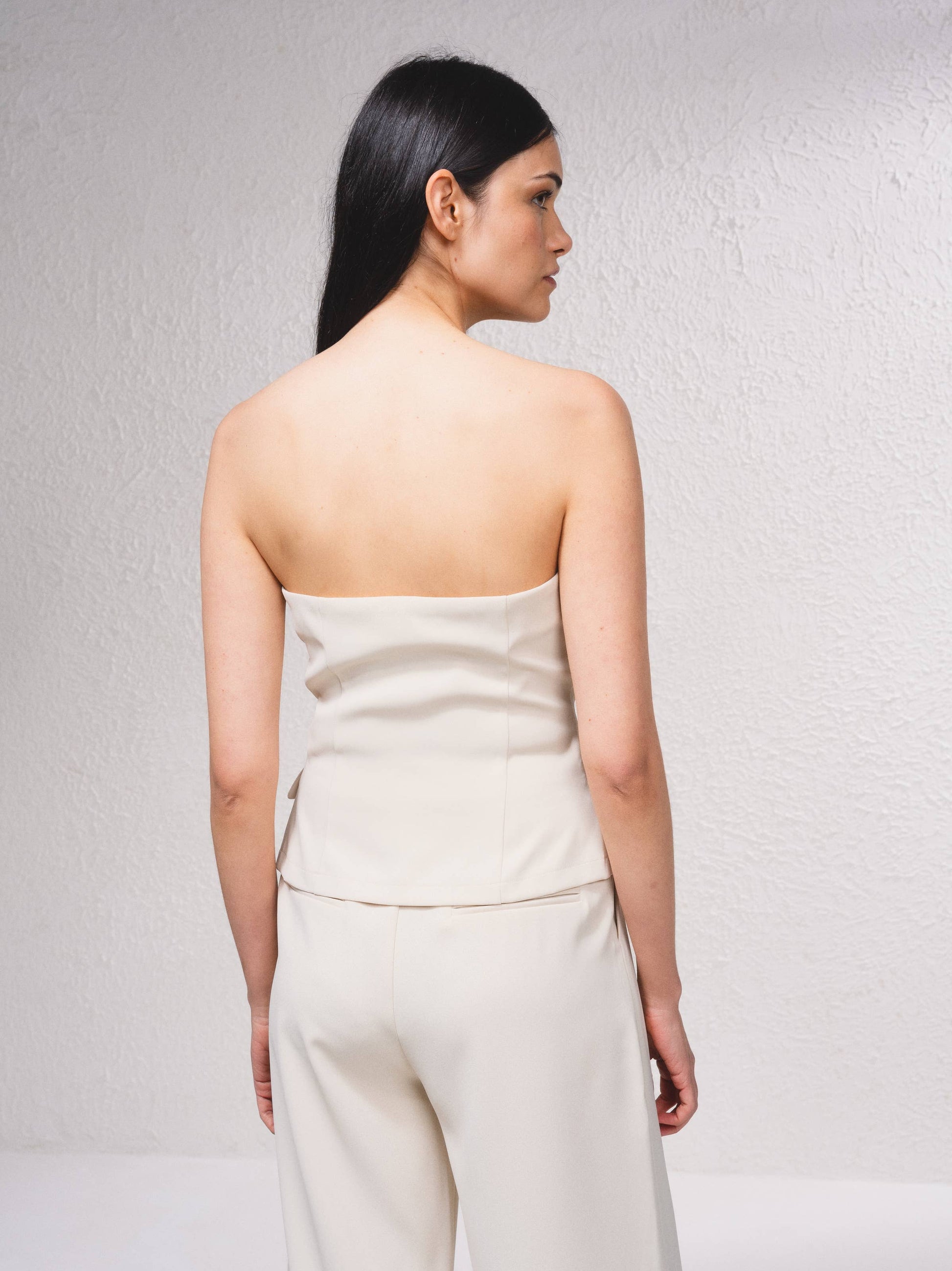 Top bustier stile gilet con bottoni frontali