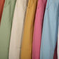 Pantaloni in twill con spille decorative