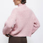 Maglione a trecce con collo alto rosa