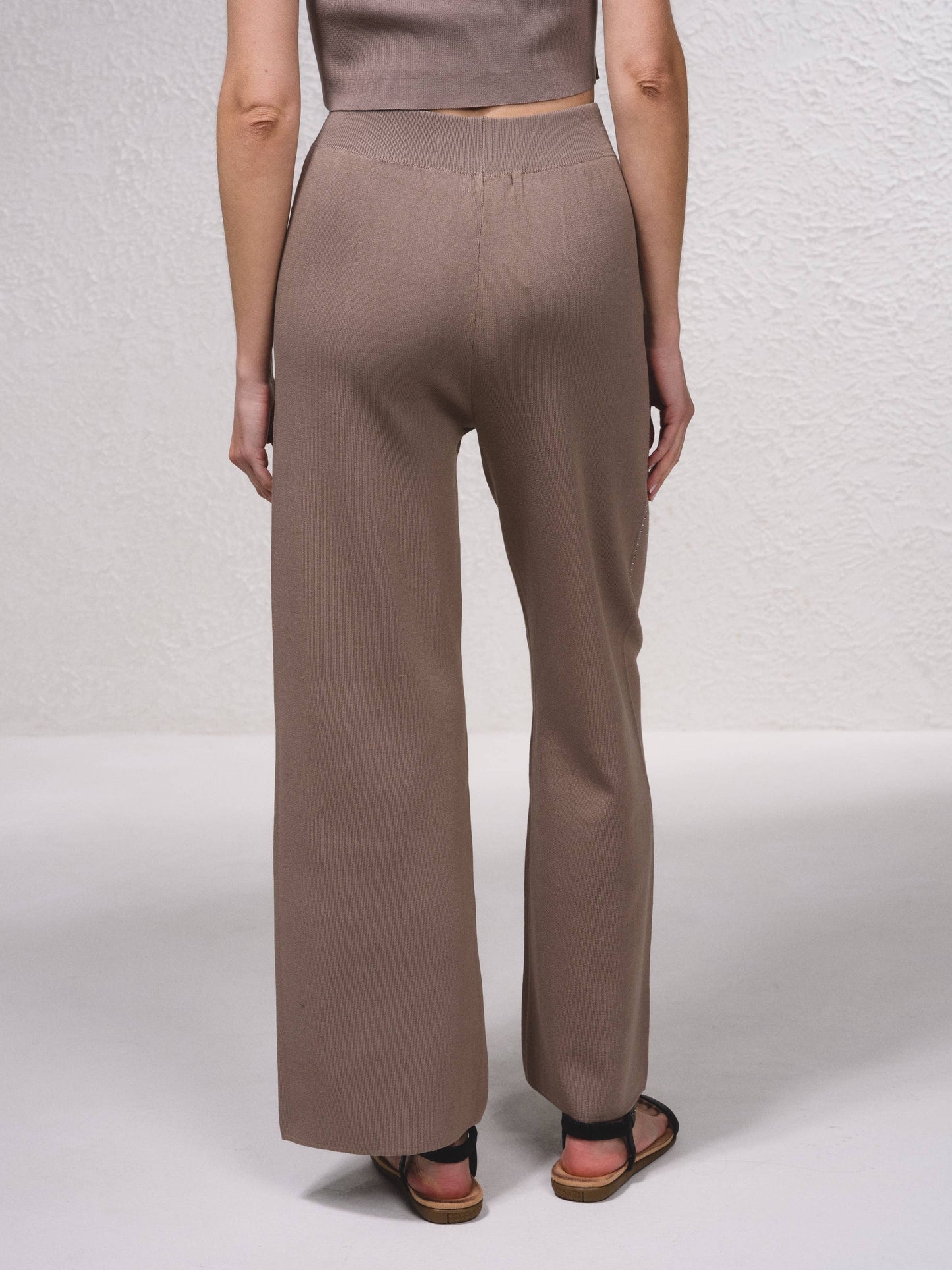 Pantaloni in maglia a gamba ampia con applicazioni glitter