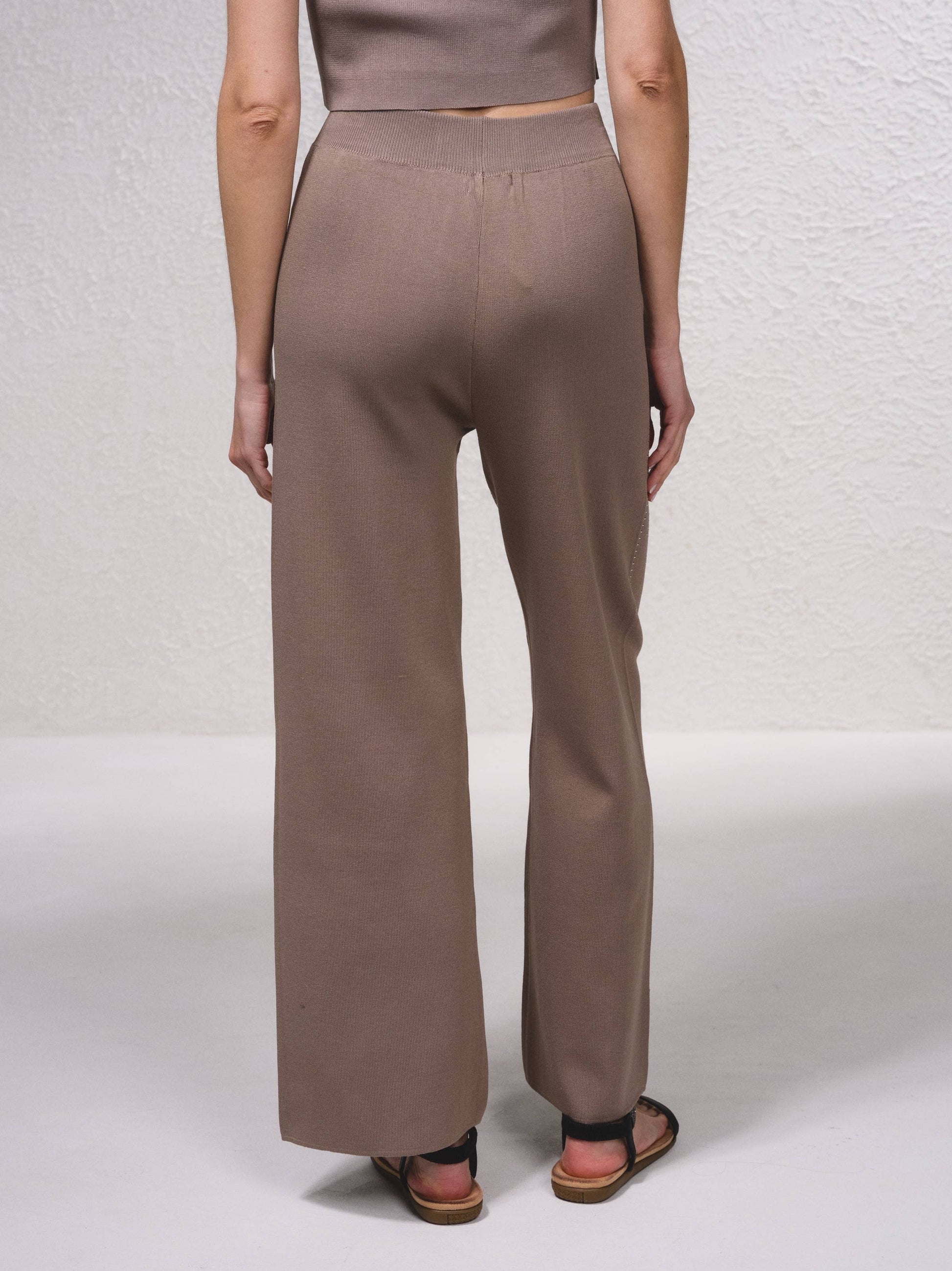 Pantaloni in maglia a gamba ampia con applicazioni glitter