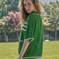 Completo in maglia traforata a righe con giacca e gonna