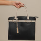 Borsa a mano in ecopelle con dettagli metallici