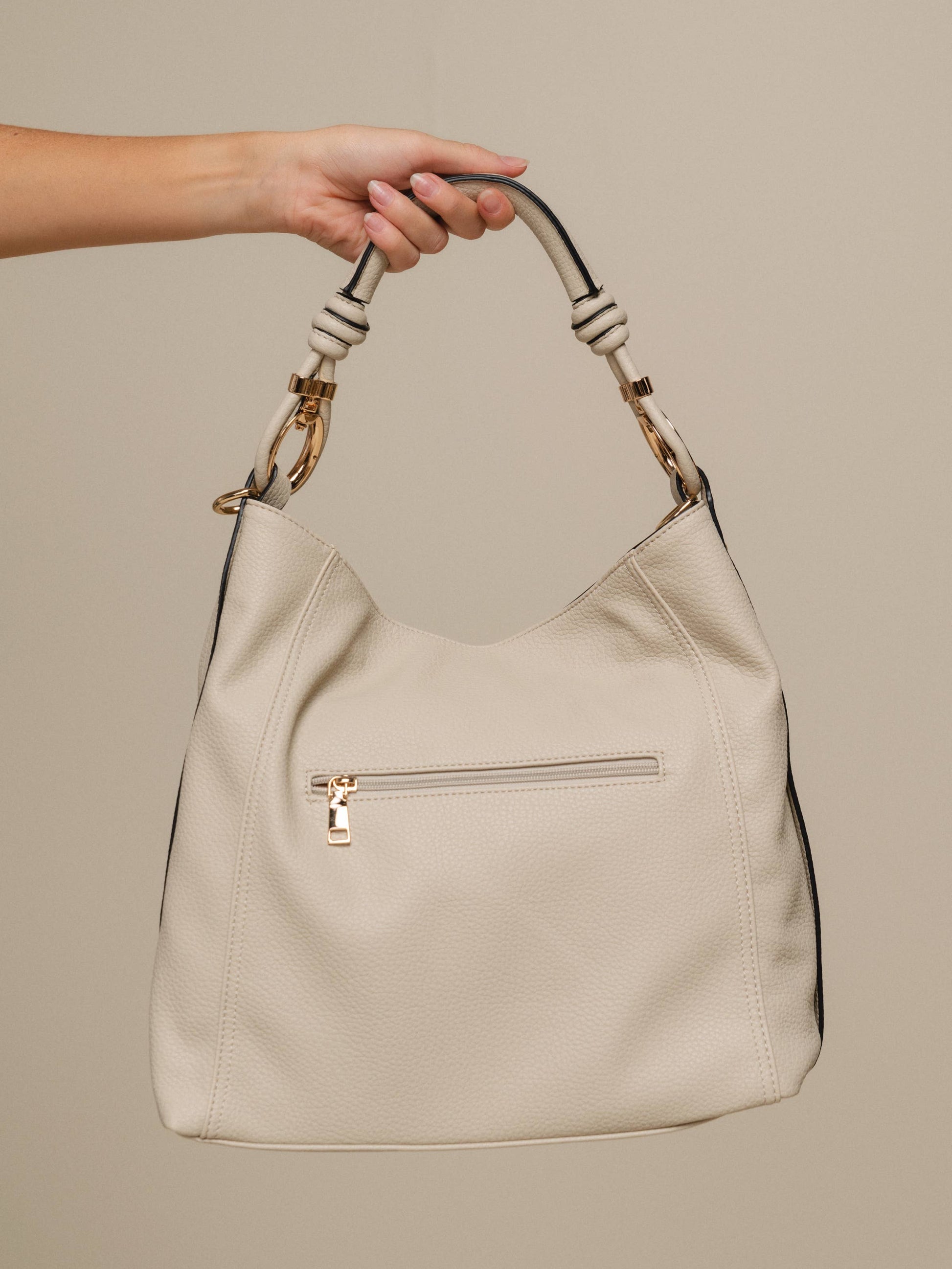 Borsa hobo in ecopelle con manico intrecciato