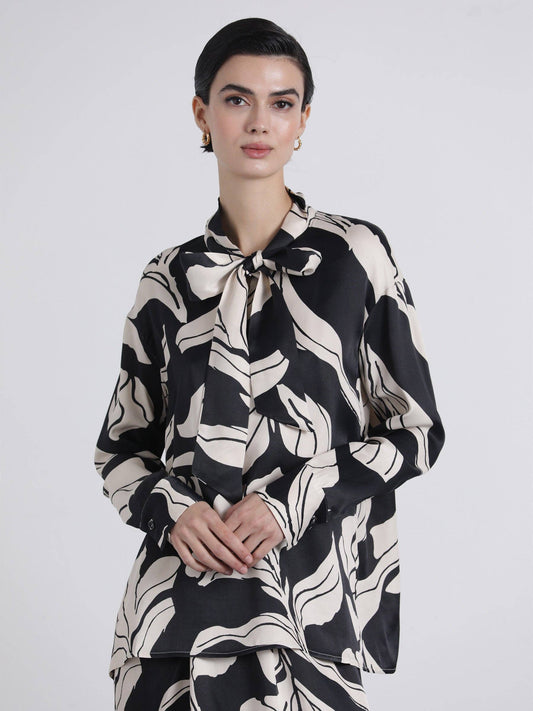 Blusa fluida con fiocco e stampa grafica