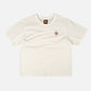 T-shirt donna pigmentata crop in cotone organico con stampa palma