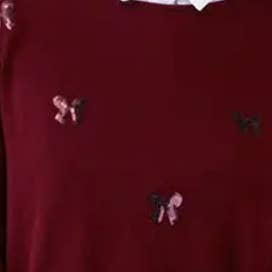 Felpa ricamata con fiocchi