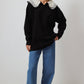 Maglione nero in maglia con colletto ricamato