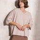 Maglia ampia in maglia con bottoni sulle maniche