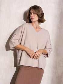 Maglia ampia in maglia con bottoni sulle maniche