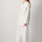 Maglia stratificata in pizzo con scollo a V