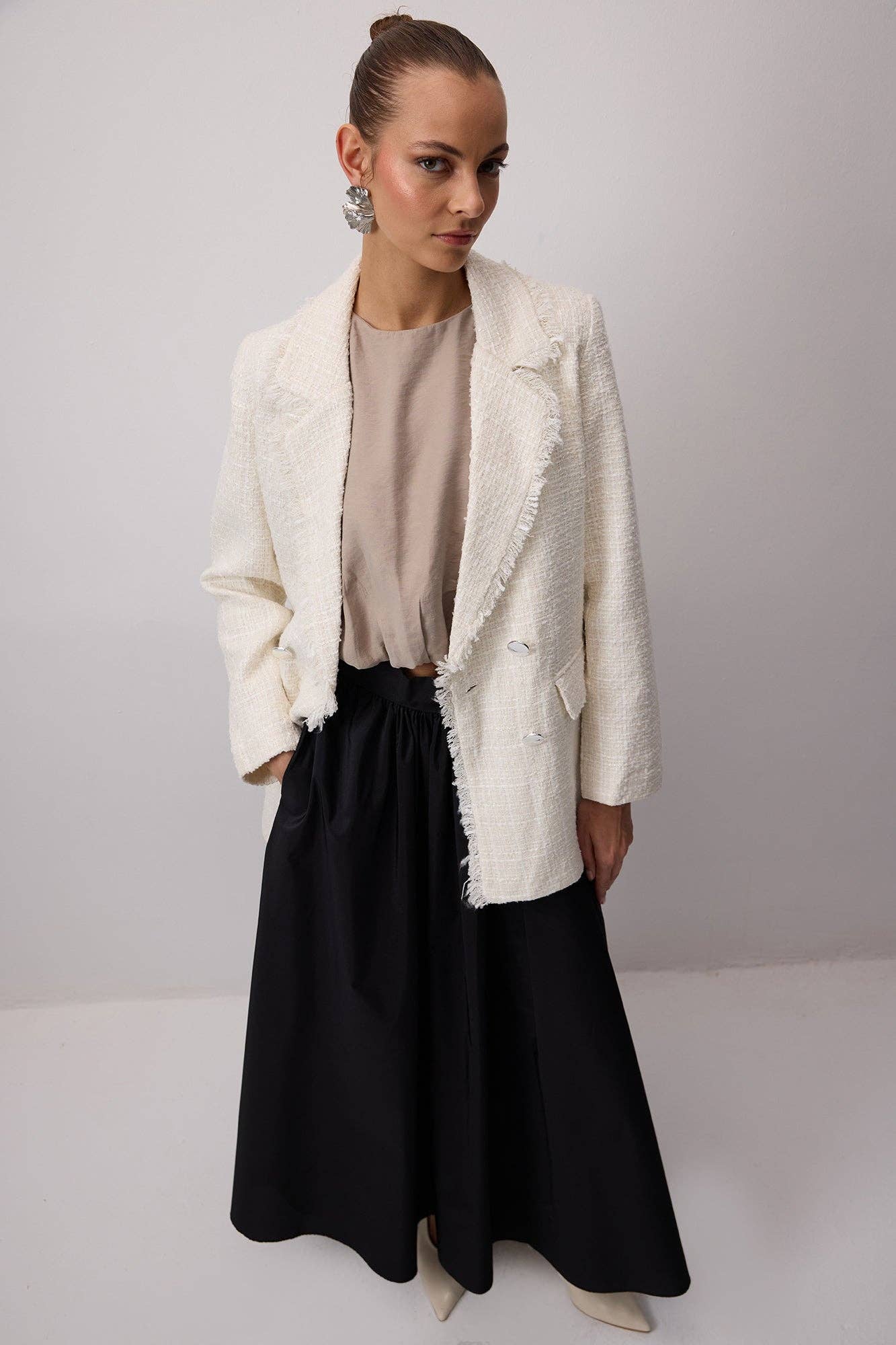 Giacca in tweed con frange