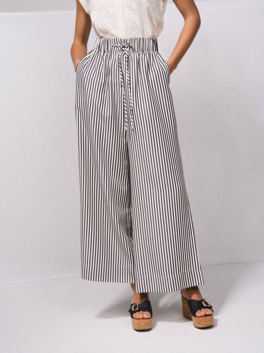 Pantaloni palazzo a righe con vita elasticizzata e laccio