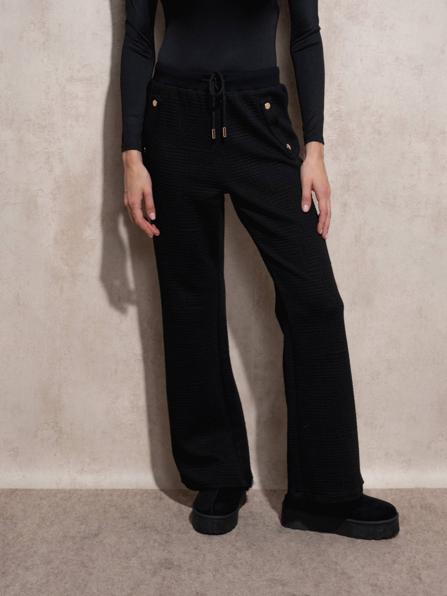 Pantaloni jogger in tessuto matelassé con coulisse