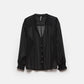Blusa a pois semitrasparente con scollo a V