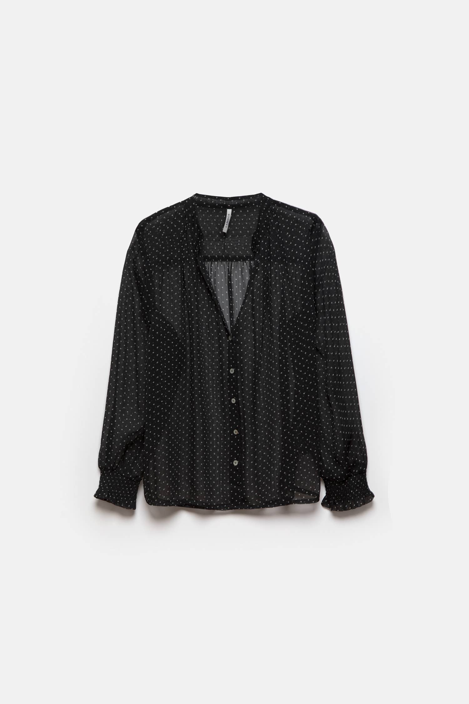 Blusa a pois semitrasparente con scollo a V
