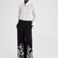 Pantaloni in crêpe neri con ricami