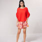 Blusa fluida con maniche a volant plissé