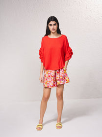 Blusa fluida con maniche a volant plissé