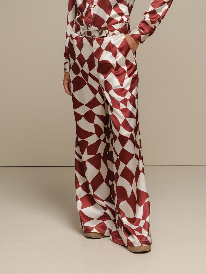 Pantaloni a palazzo con stampa geometrica color ruggine