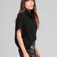 Pull oversize nero stile poncho con collo alto
