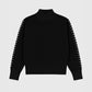 Maglione dolcevita nero Nissya con cuciture a contrasto
