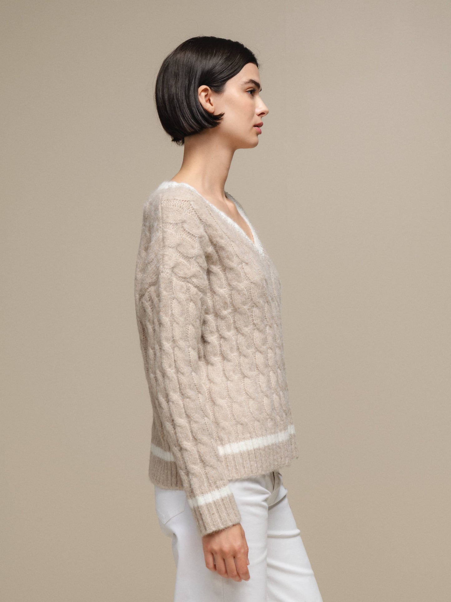 Maglione donna a trecce con scollo a V