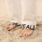 Pantaloni denim a pieghe Hope Heals