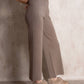 Pantaloni a vita alta in maglia con glitter
