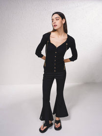 Cardigan in maglia a coste con catene dorate