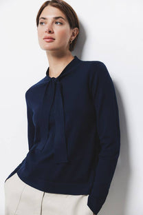 Maglione in maglia rasata con fiocco e scollo a V