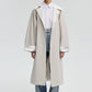 Trench oversize con maniche raglan e cintura