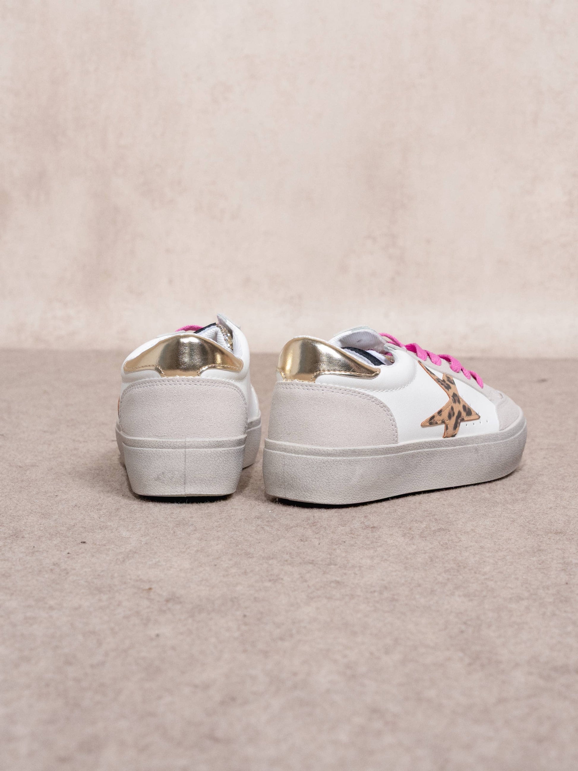 Sneakers platform con stella animalier e glitter