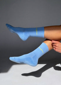 Calzini azzurro baby con scritta “Bonjour”