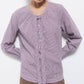 Blusa a quadretti con fiocco e bottoni a contrasto