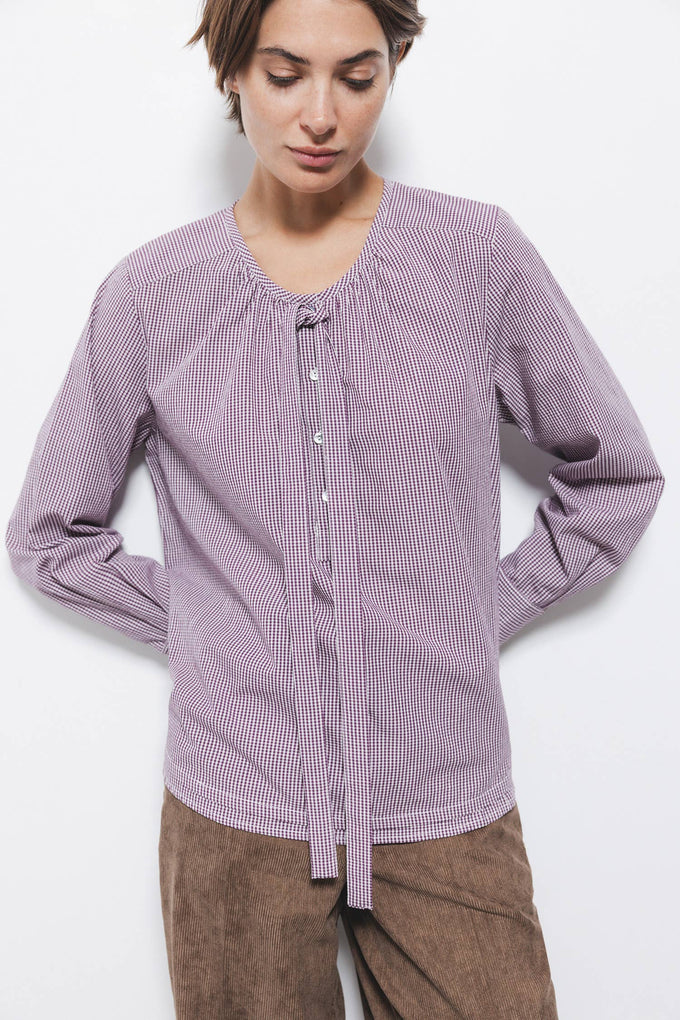 Blusa a quadretti con fiocco e bottoni a contrasto