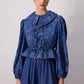 Completo in denim con tunica e gonna a fantasia
