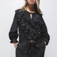 Blusa nera con volant e laccio al collo