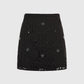 Gonna mini Romie in pizzo nero con ricami gioiello