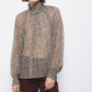 Blusa semitrasparente animalier con collo alto
