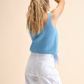 Top in tricot con piume
