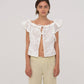 Top bianco Lux con volant e ricami