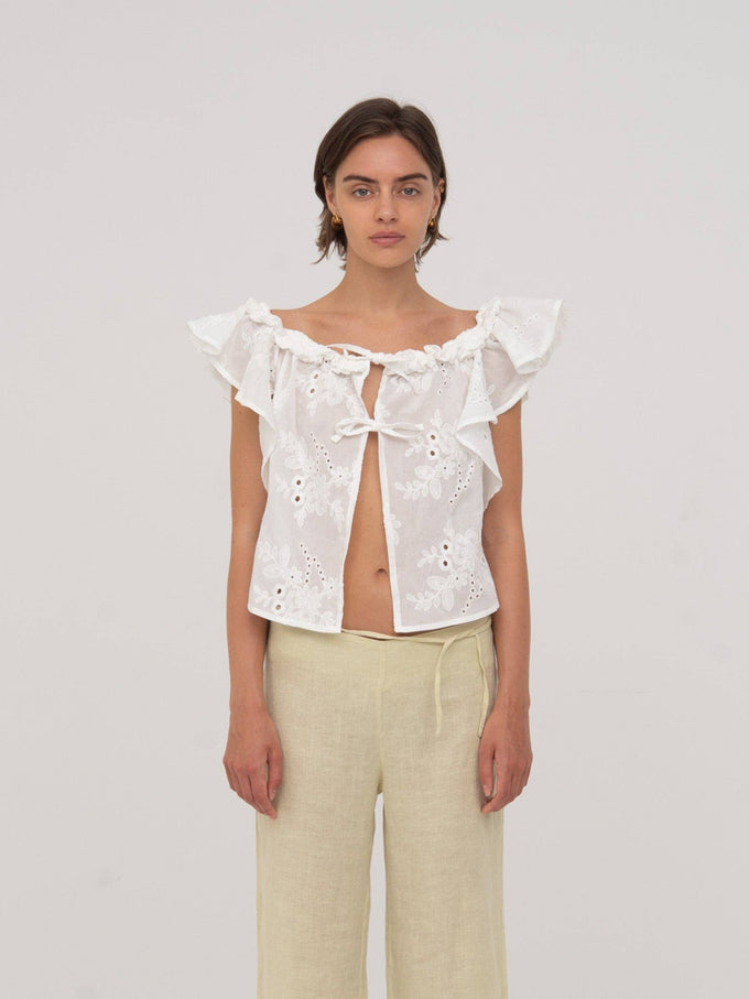Top bianco Lux con volant e ricami