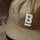 Cappellino in tela cerata con logo ricamato